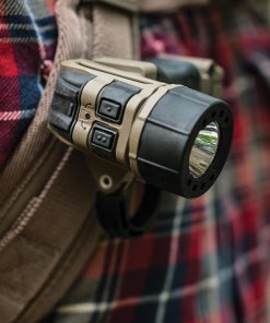 TORQ tactical flashlight on a backpack strap.